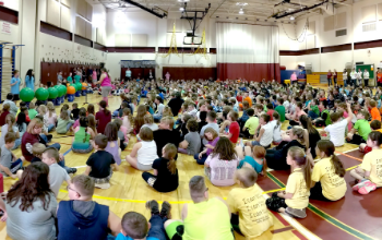 Students in gymnasium for ACES