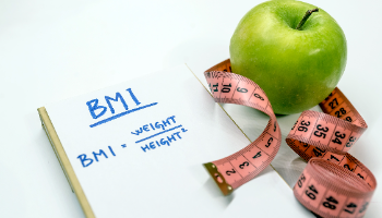 Body Mass Index with apple and tape measure (file)