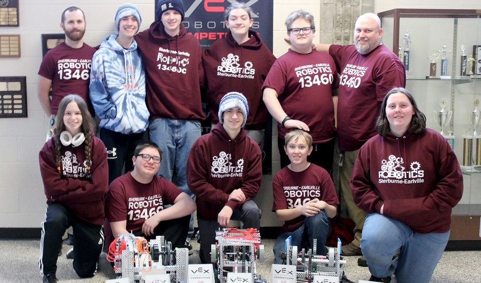 S-E Robotics teams and coaches with trophies (3/2023)